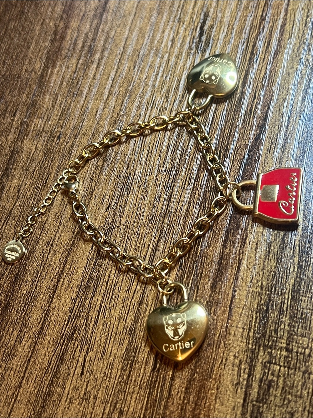 Gold-Tone Charm Bracelet with Red Bag and Heart Charms